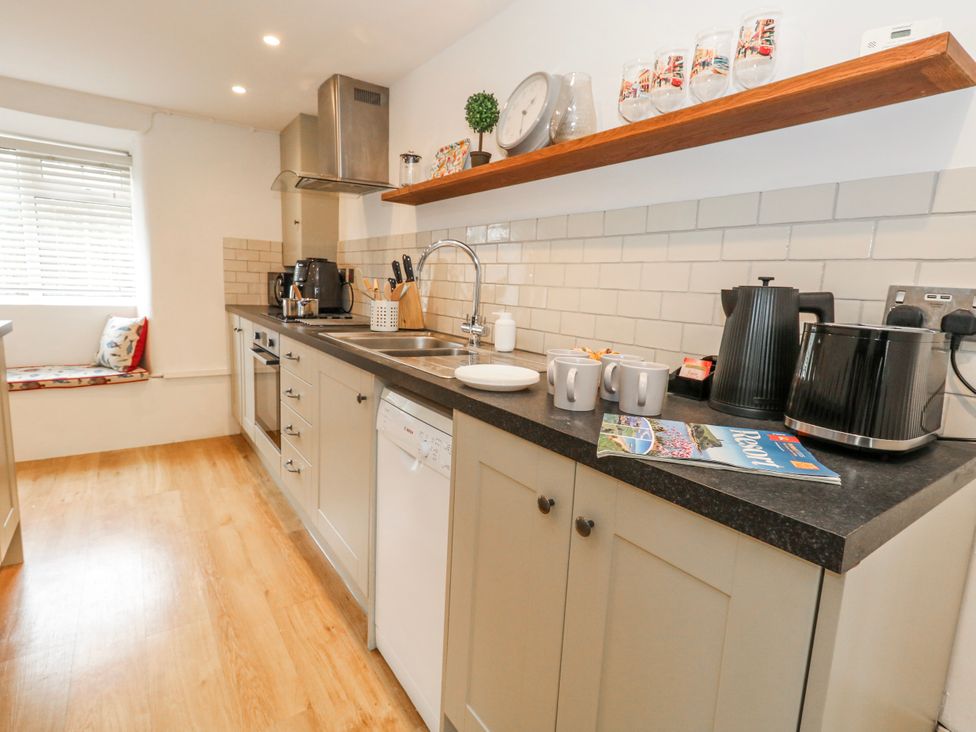 A kitchen with appliances and utensils at Long Barn in Burton Bradstock