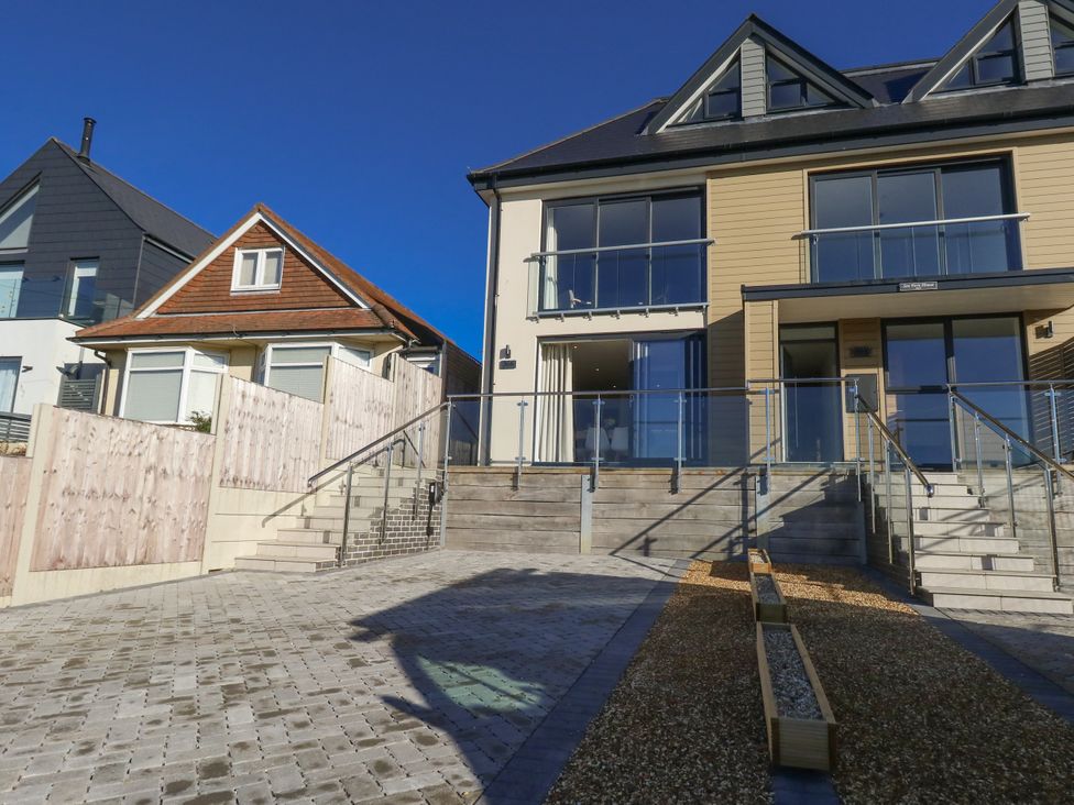 A house with stairs and outdoor area at Seafern House 36B Poole