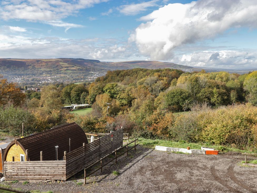 A view of hills and trees with a cabin at Cwtch Bach Aberdare