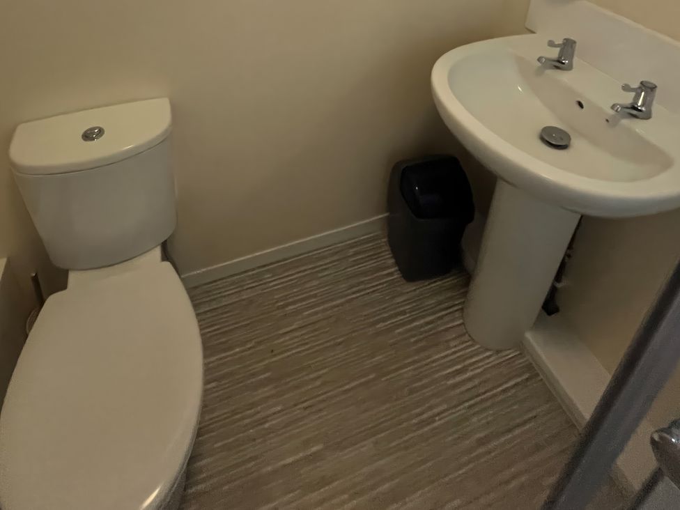 A bathroom with a toilet and sink at Stanbury
