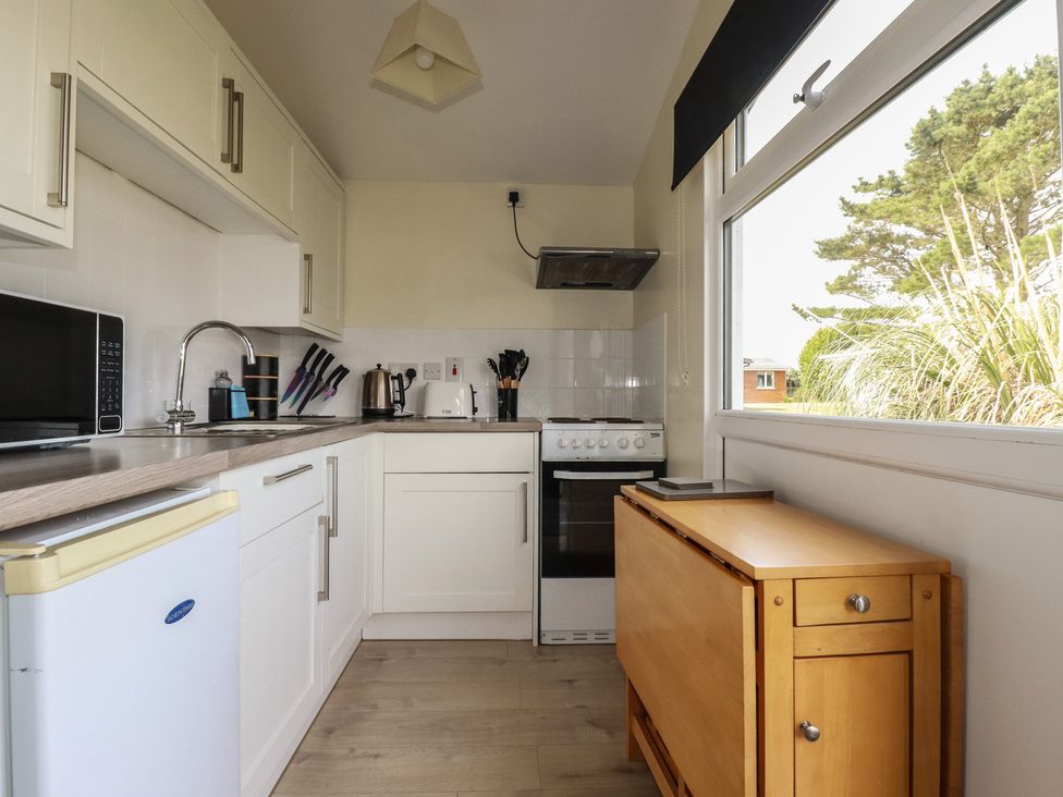 A kitchen with appliances and cabinets at Stanbury in St Merryn
