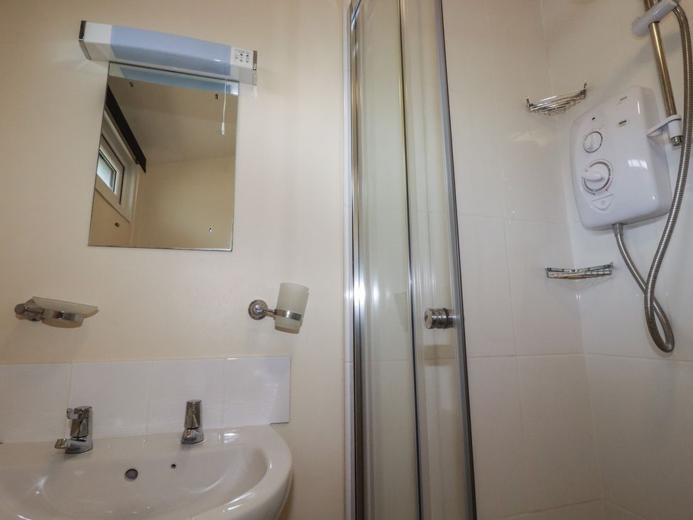 A bathroom with a sink and shower at Stanbury in St Merryn
