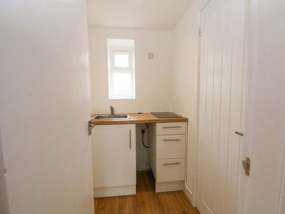 A kitchen with a sink and countertop at 1 bed no. 1