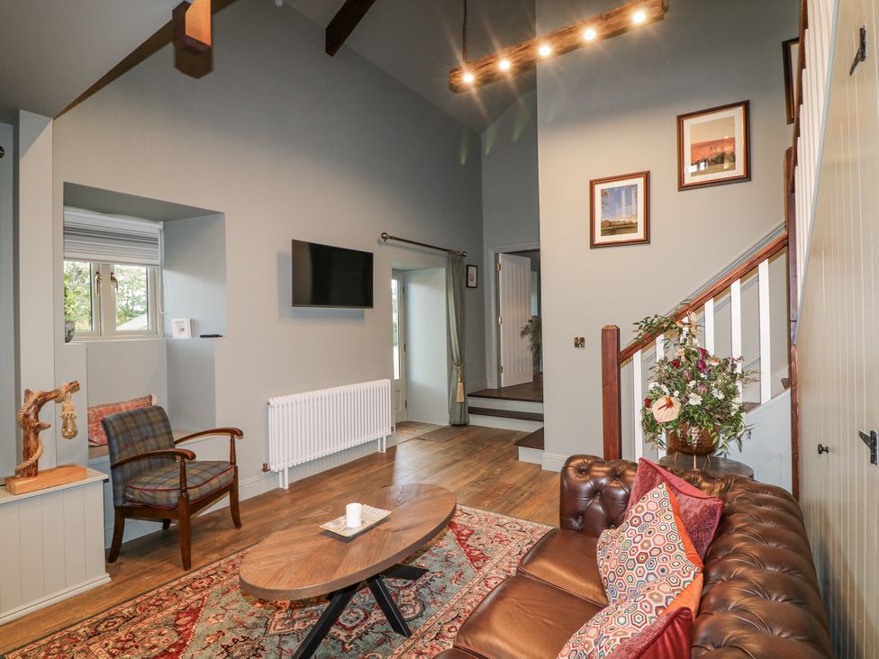 A living room with a sofa and coffee table at Robins Rest at The Lodge Kilmacthomas