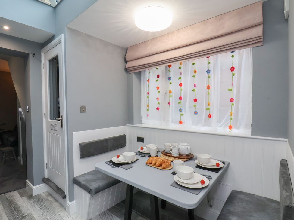 A dining room with a table set for breakfast at Arthur's House in Middlesbrough