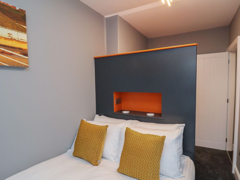 A bedroom with a bed and a painting at Arthur's House in Middlesbrough