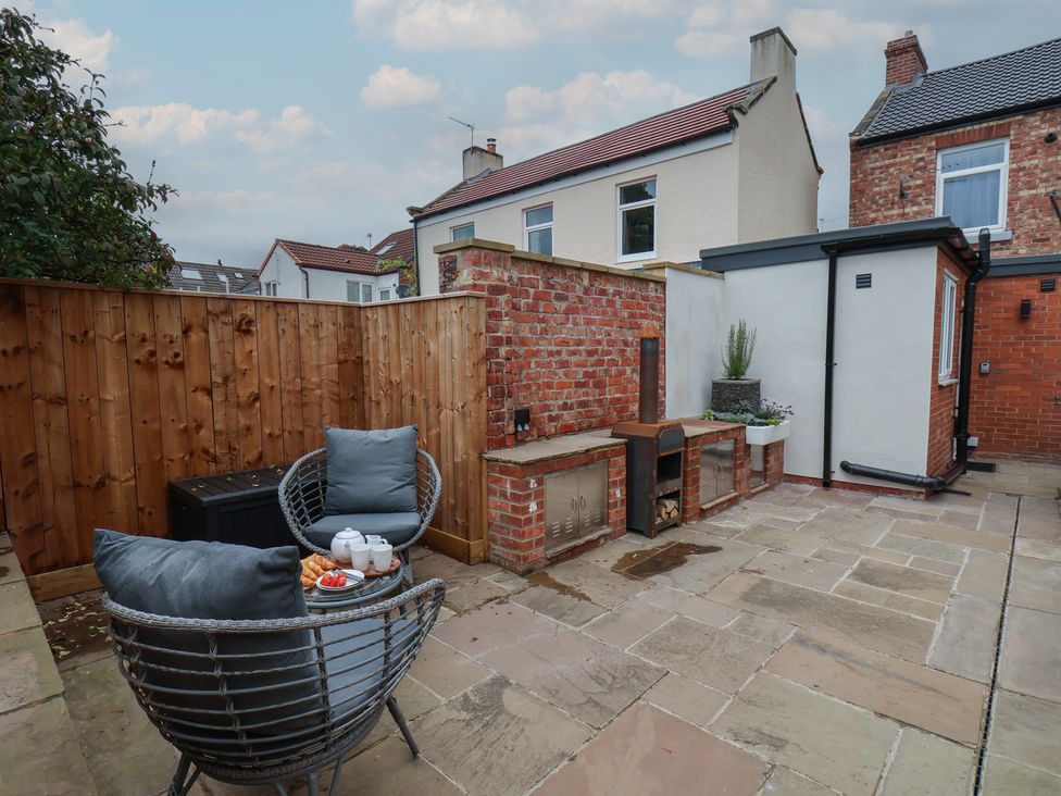 A garden with seating area and outdoor fire pit at Arthur's House in Middlesbrough