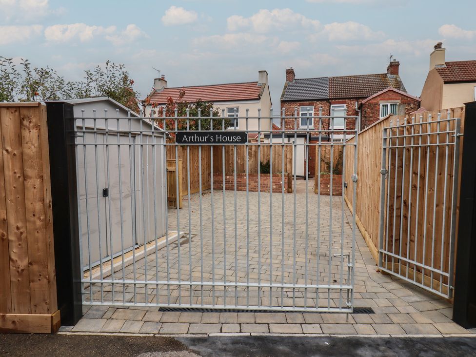 A gated outdoor area with paving stones at Arthur's House in Middlesbrough
