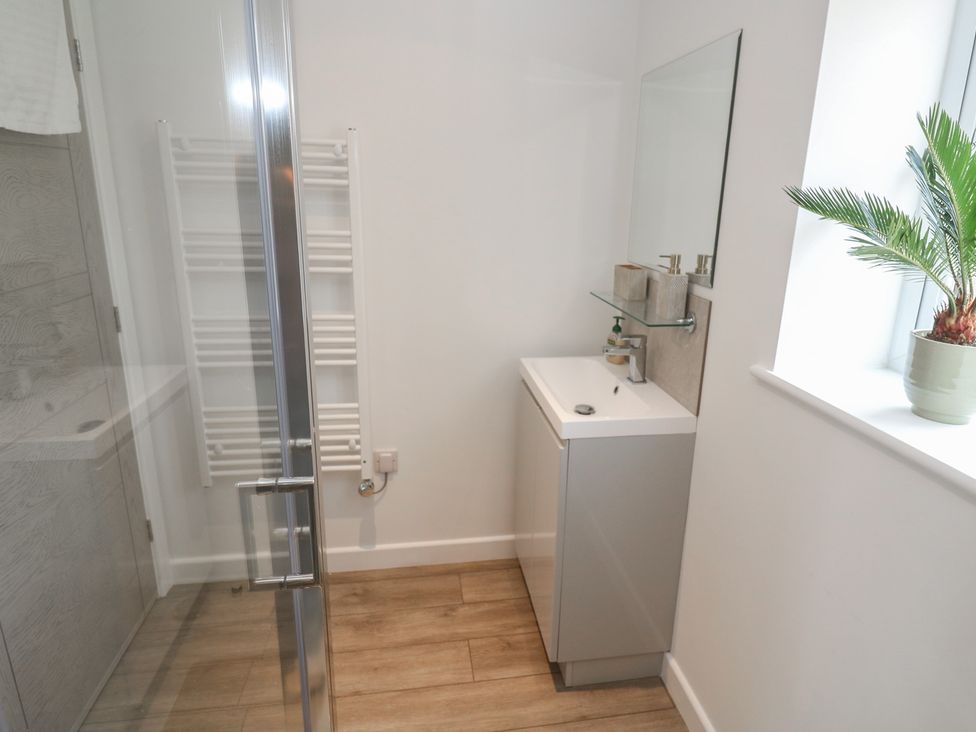 A bathroom with a shower and sink at Cosy Retreat in 