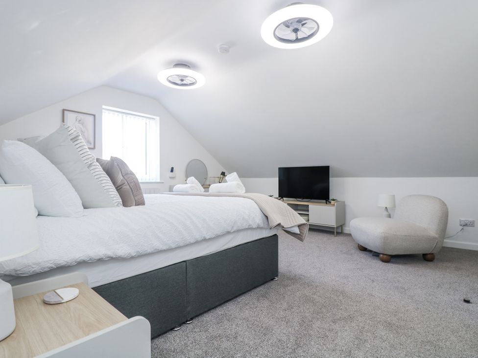 A bedroom with a bed and television at Cosy Retreat in Pool