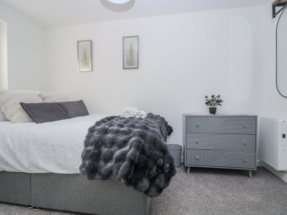 A bedroom with a bed and a dresser at Cosy Retreat in Pool