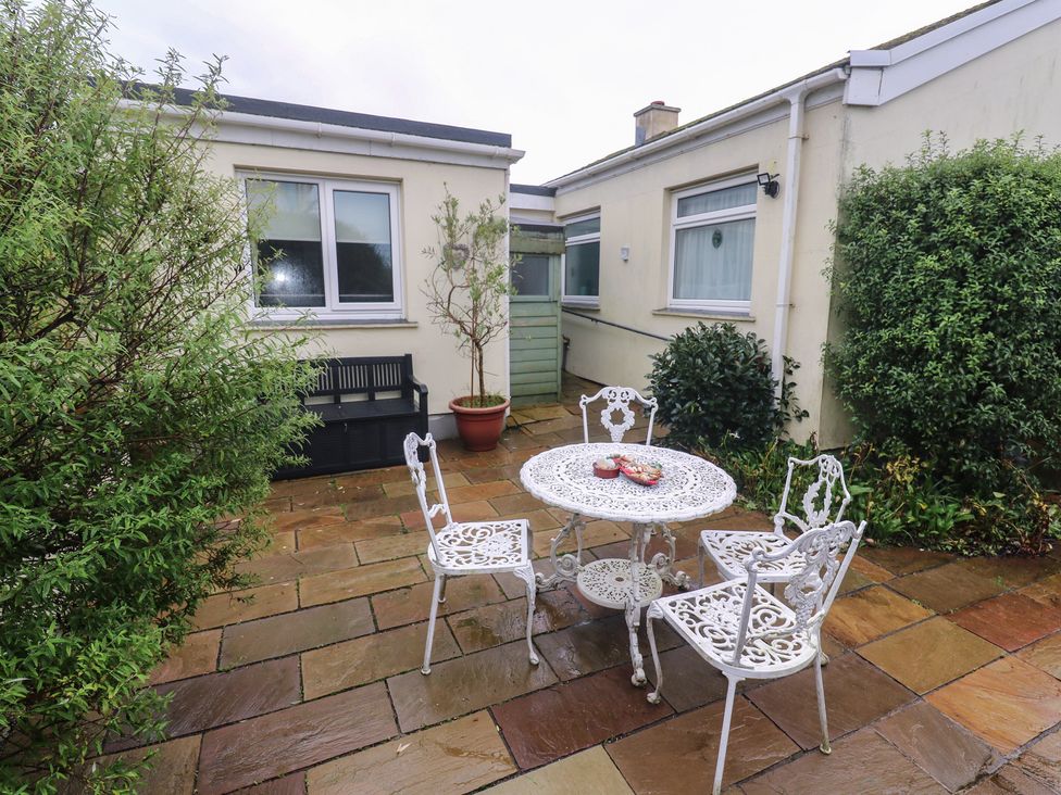 An outdoor area with a table and chairs at Sea Whispers in Marazion