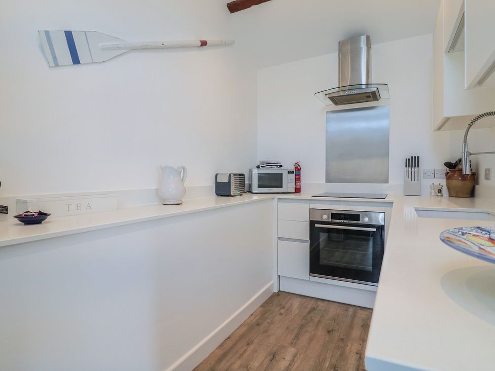 A kitchen with appliances and tea container at Avocet in Lyme Regis