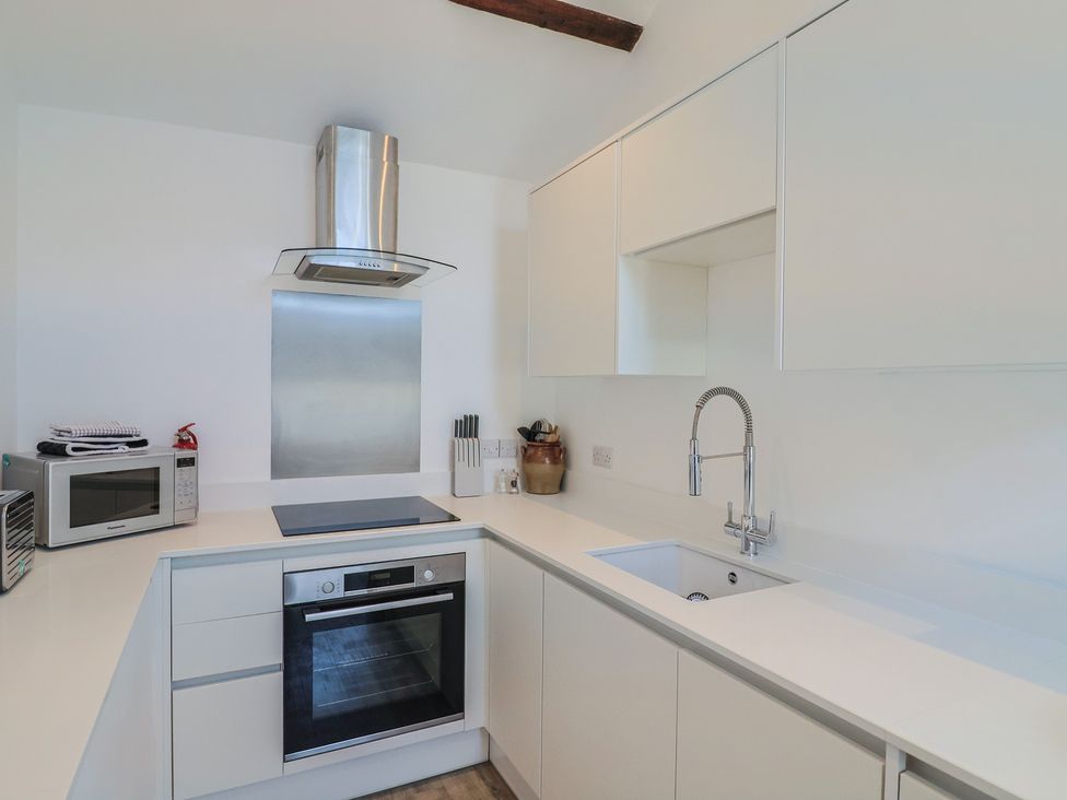 A kitchen with appliances and countertops at Avocet in Lyme Regis