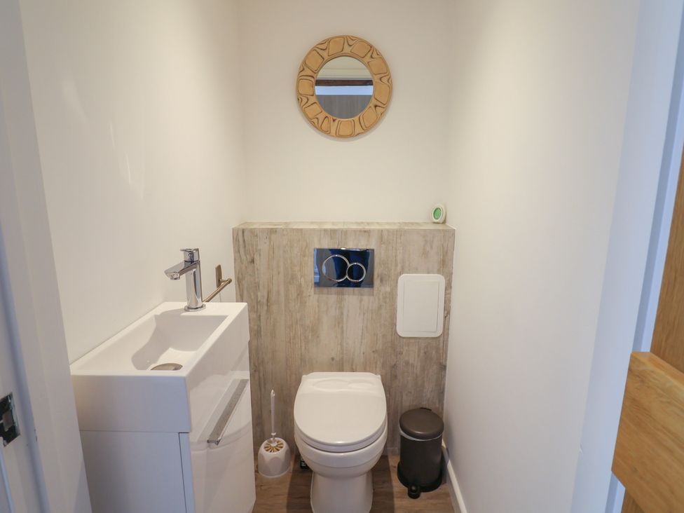 A bathroom with a sink and toilet at Avocet in Lyme Regis