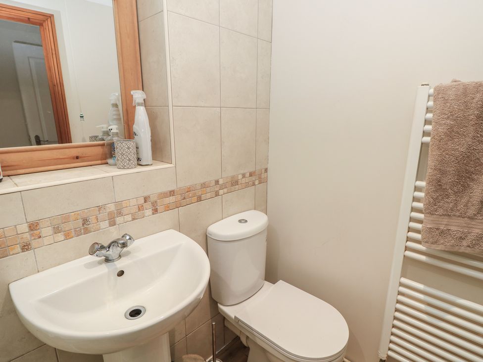 A bathroom with sink and toilet at The Bookshop Apartment in Cowes