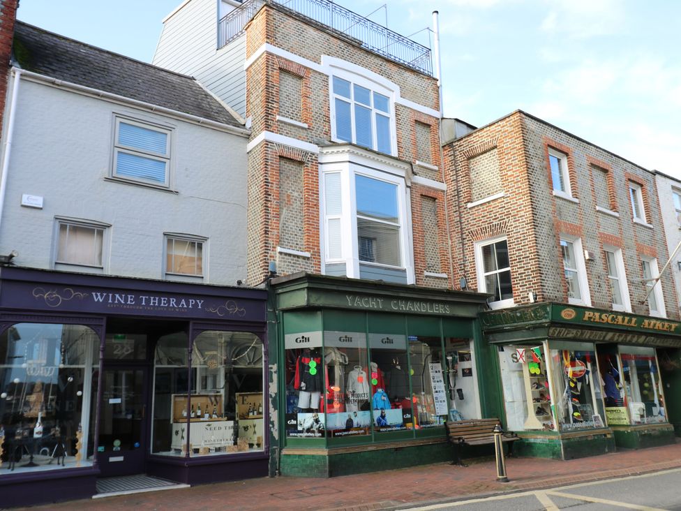 A street view with shops at The Bookshop Apartment in Cowes