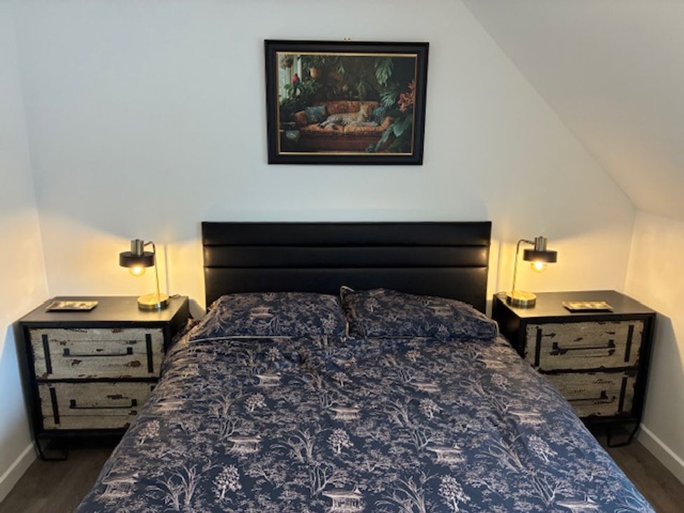 A bedroom with a bed and nightstands at Harbour Way in Shoreham-By-Sea