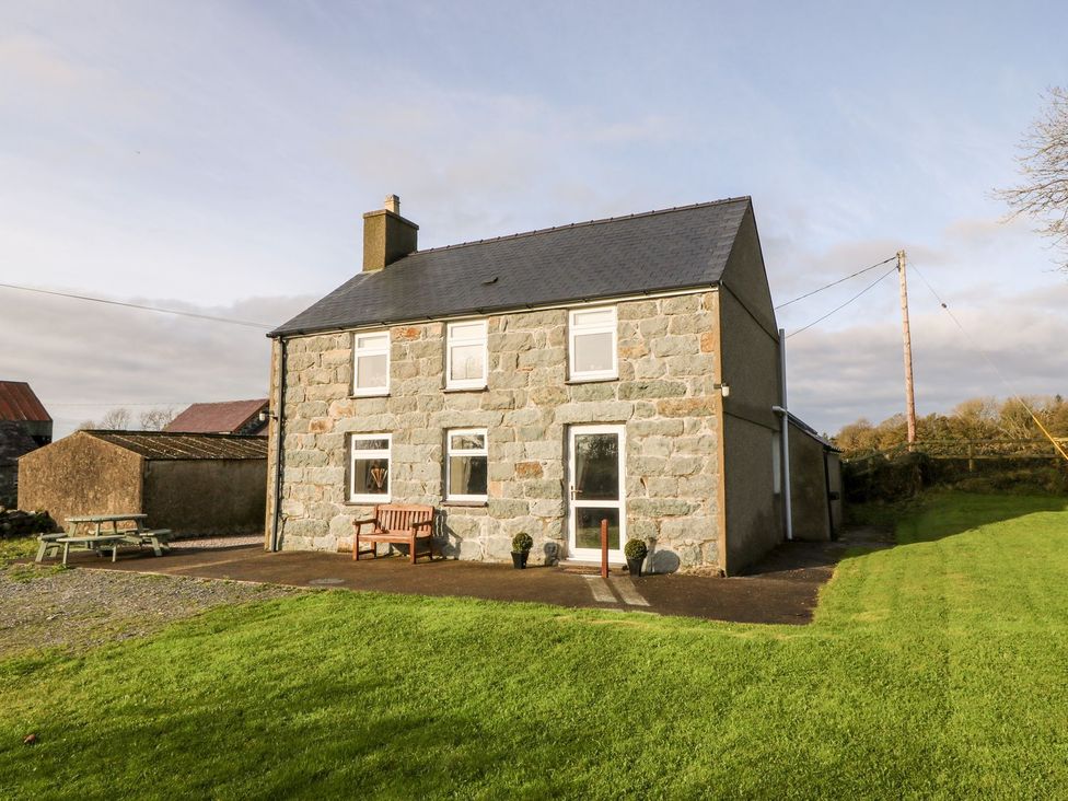 A house with a front yard and pathway at The Old Barn in Pwllheli