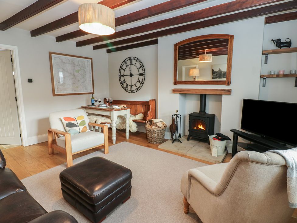 A living room with furniture and a fireplace at Daleholme Mickleton, Teesdale