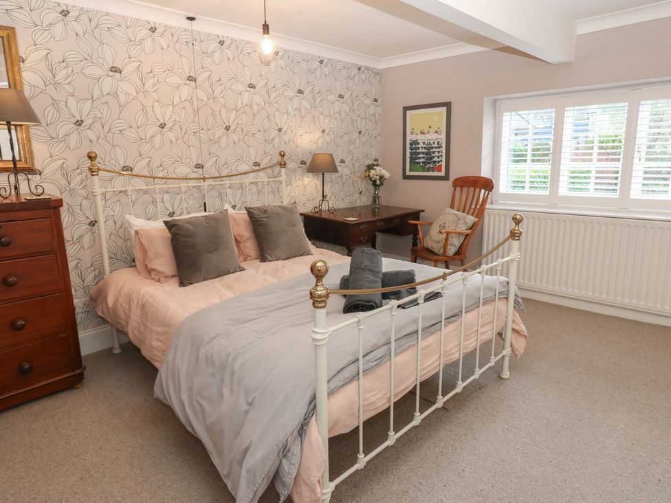 A bedroom with a bed and desk at Daleholme Mickleton, Teesdale