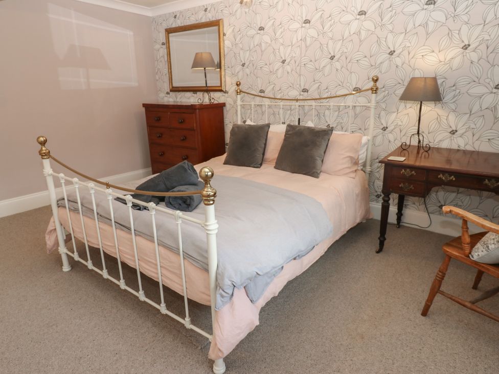A bedroom with a bed and furniture at Daleholme in Mickleton, Teesdale