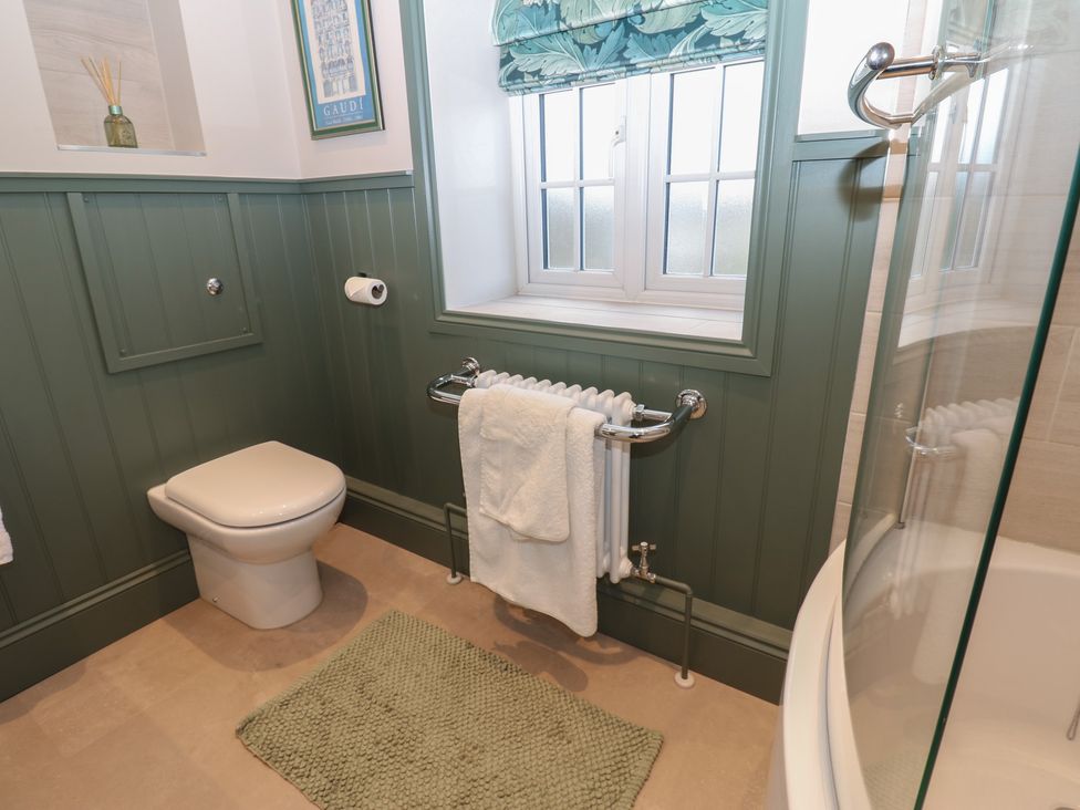 A bathroom with a toilet and shower at Daleholme Mickleton, Teesdale