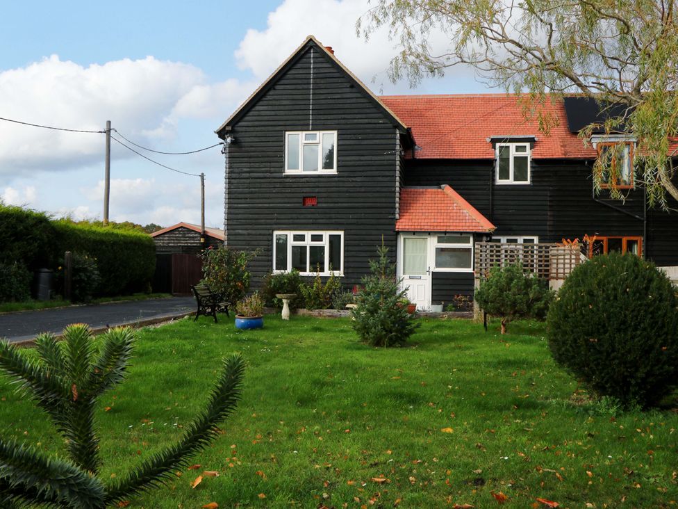 A house with a pathway and grass area at 7 Oaks Track in Carshalton