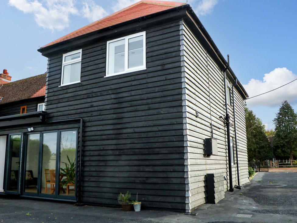 A house with windows and a door at 7 Oaks Track in Carshalton