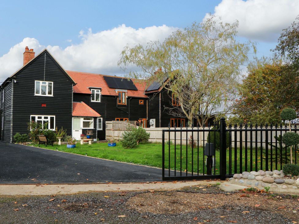 A house with a gate and garden at 7 Oaks Track in Carshalton