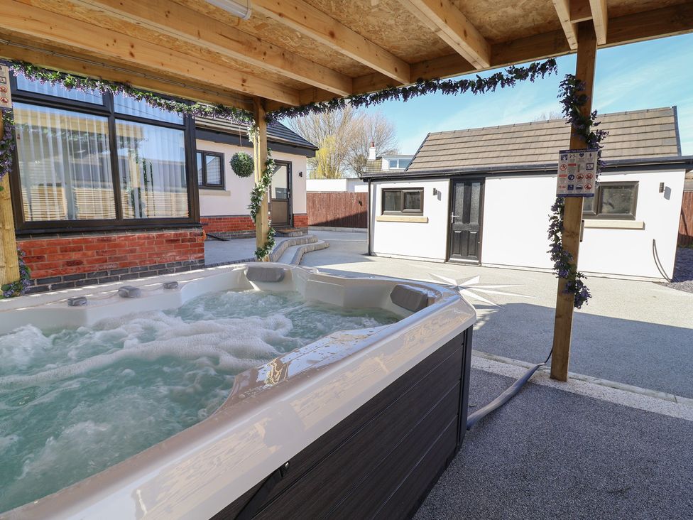 A hot tub in an outdoor area at 1 Talbot Drive in Talacre