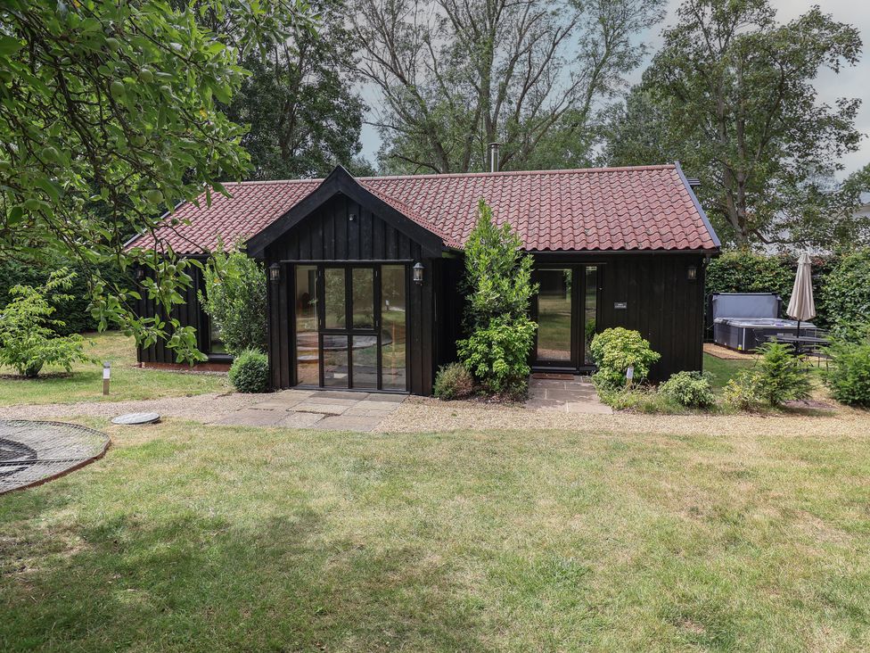 A house with a garden and pathway at Owl Cottage in Kettleburgh near Framlingham