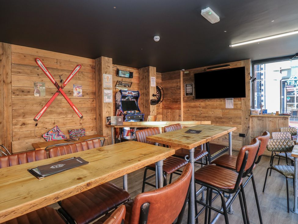 A dining room with tables and chairs at Chalet 86 in North Shields