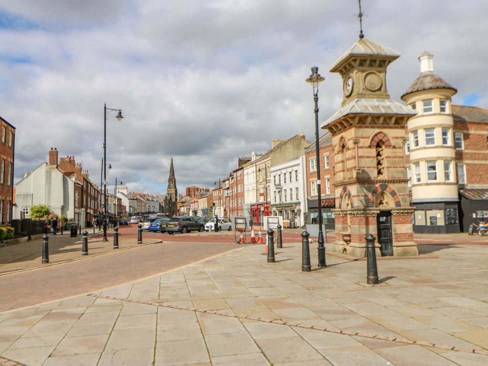 A street scene with a clock tower and buildings at Chalet 86 in North Shields