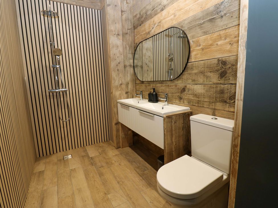A bathroom with a shower and sink at Chalet 86 Tynemouth