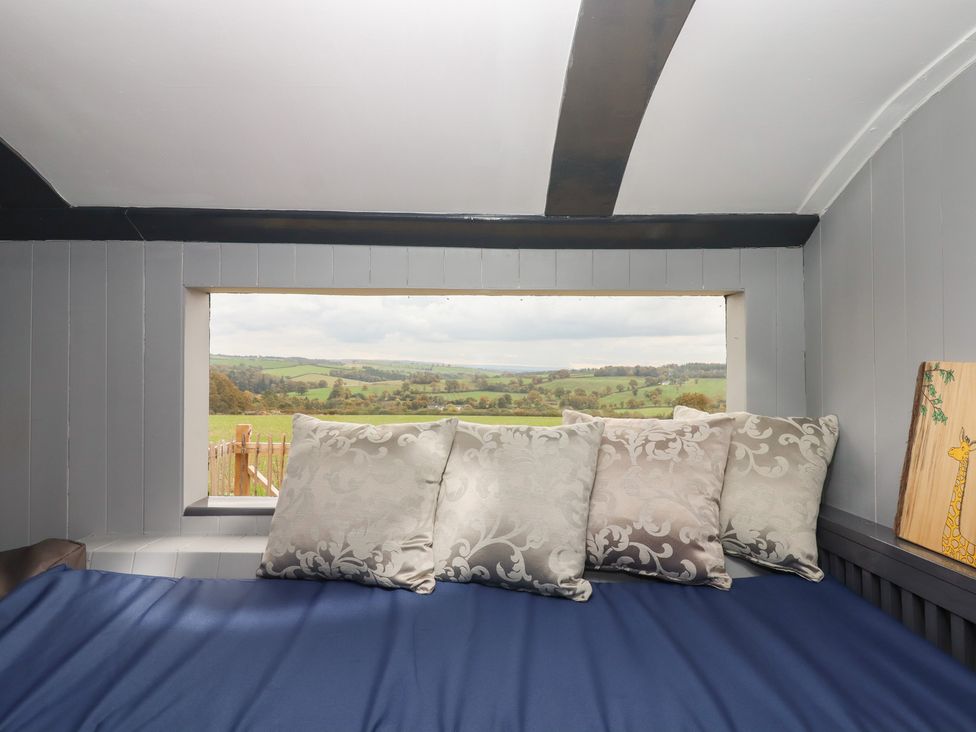 A snug with pillows and a view at The Bus on the Hill 