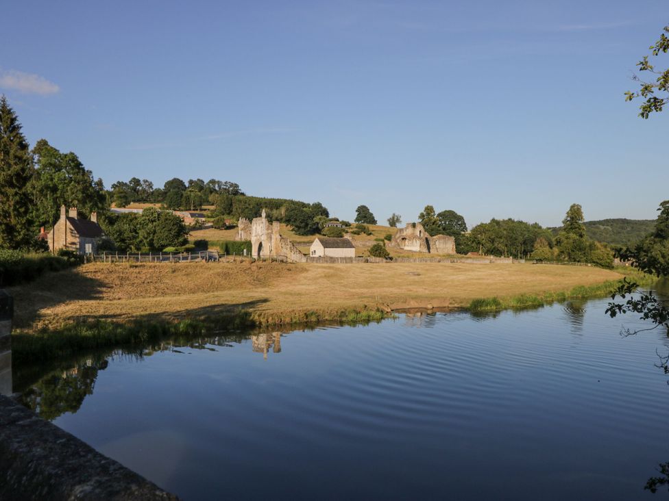 A landscape with a river and ruins at 127 Bellhouse Way York