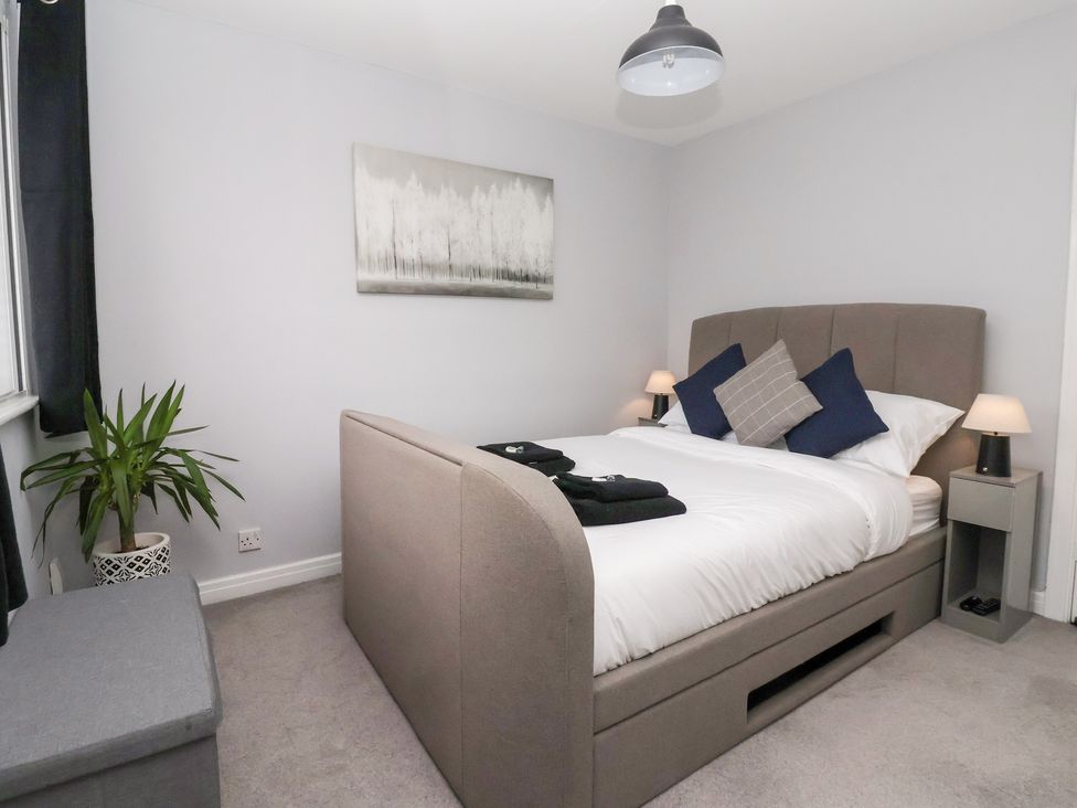 A bedroom with a bed and a plant at 127 Bellhouse Way, York