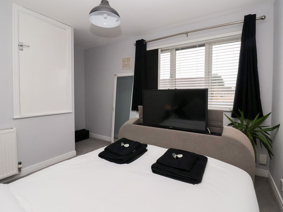 A bedroom with a bed and television at 127 Bellhouse Way York