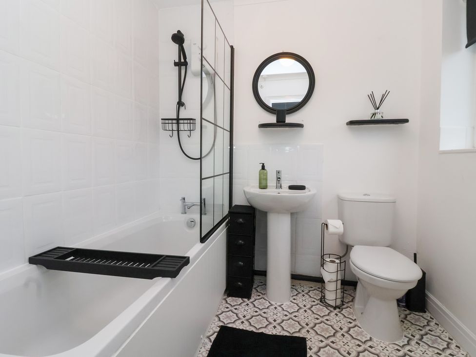 A bathroom featuring a bathtub, sink, and toilet at 127 Bellhouse Way York