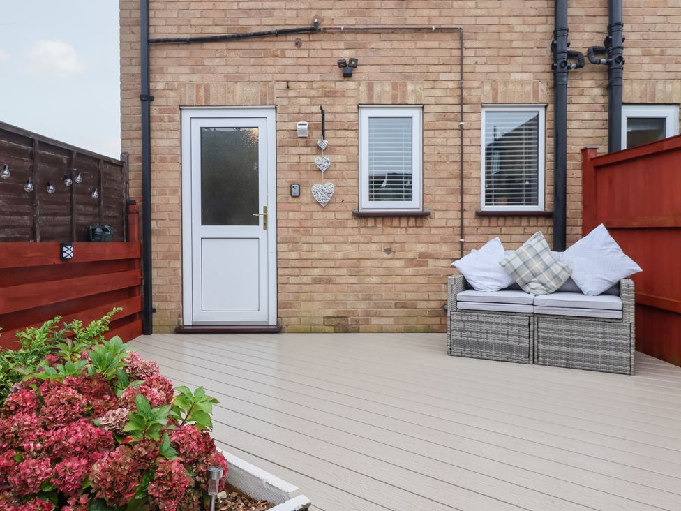 An outdoor area with a door and seating at 127 Bellhouse Way, York