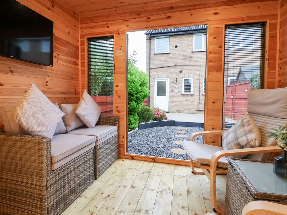 A snug with seating and a view of the garden at 127 Bellhouse Way, York