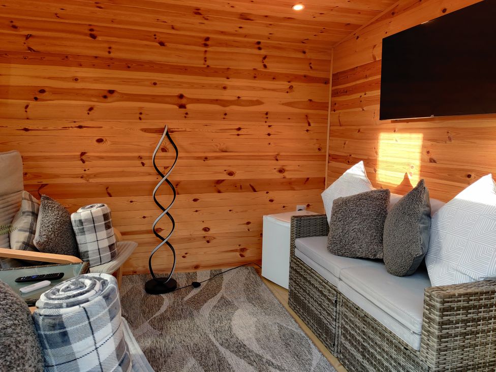 A snug with a sofa and pillows at 127 Bellhouse Way, York