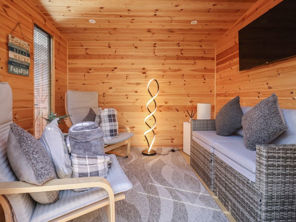 A snug with seating and a lamp at 127 Bellhouse Way in York