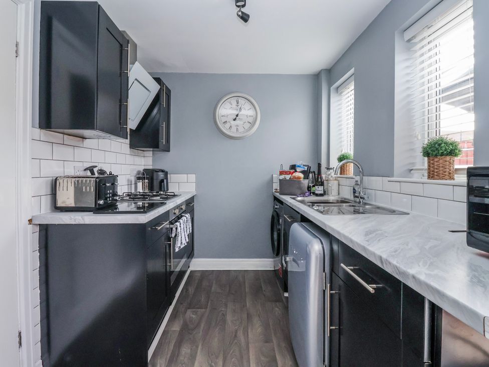 A kitchen with cabinets, appliances, and a sink at 127 Bellhouse Way, York