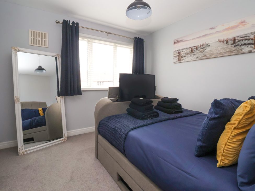 A bedroom featuring a bed and television at 127 Bellhouse Way in York