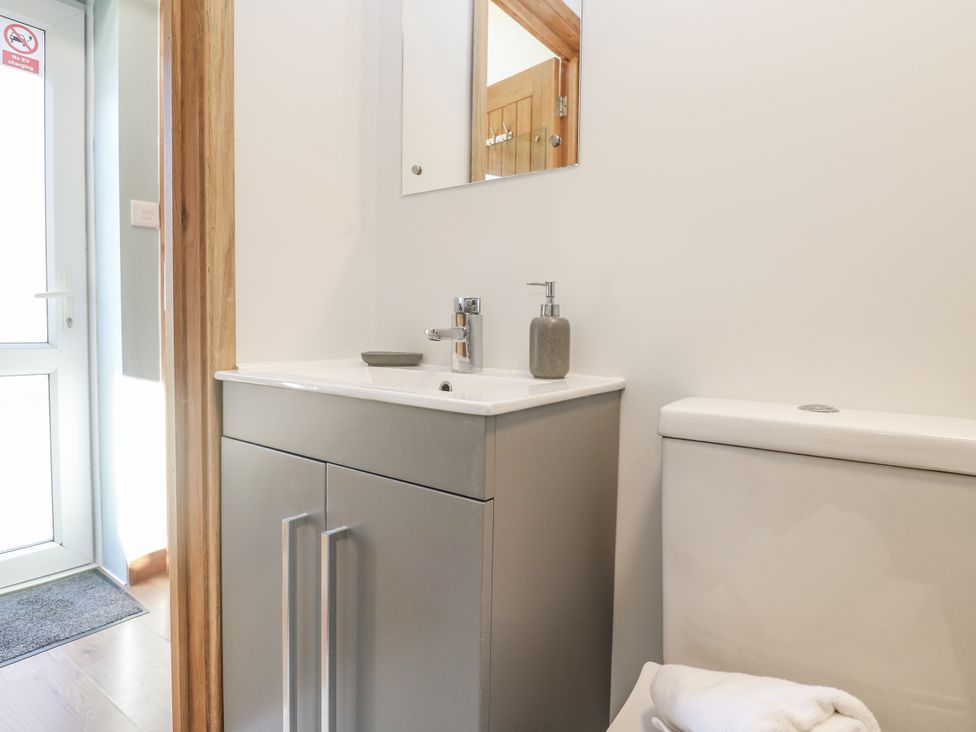 A bathroom with a sink and toilet at Blake Lodge in Crantock