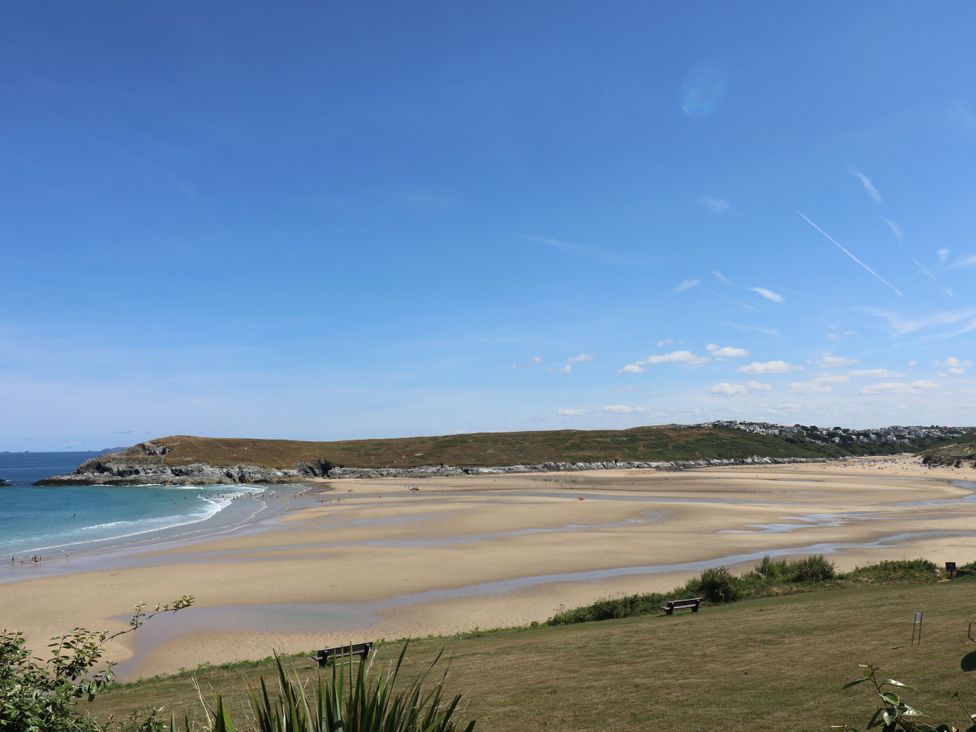 A beach with sand and sea at Blake Lodge in Crantock