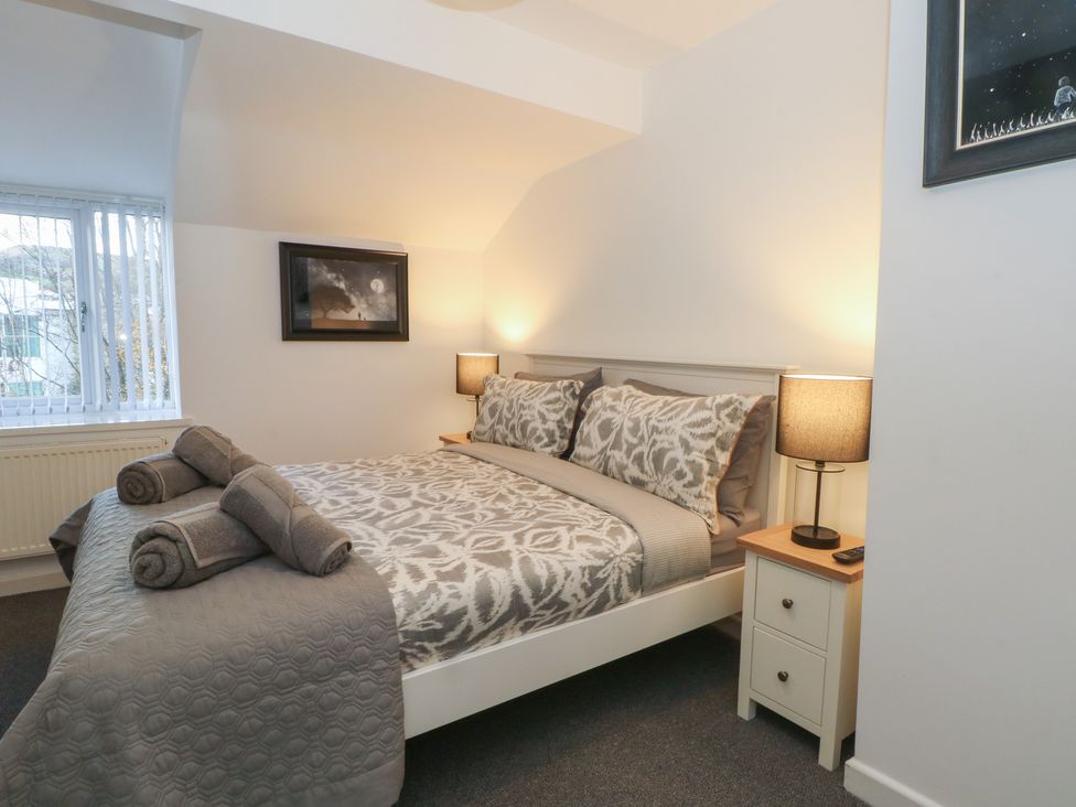 A bedroom with a bed and bedside table at 32B Bank Street in Rossendale