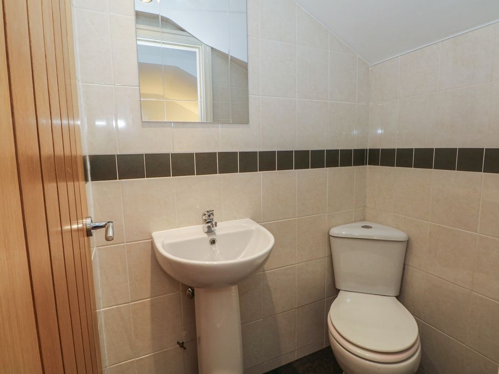 A bathroom with a sink and toilet at 32B Bank Street in Rossendale